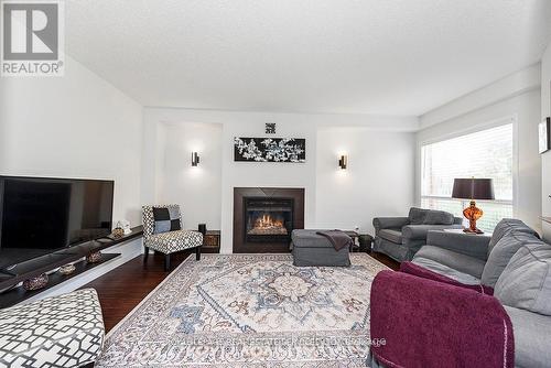 635 Commonwealth Crescent, Kitchener, ON - Indoor Photo Showing Living Room With Fireplace