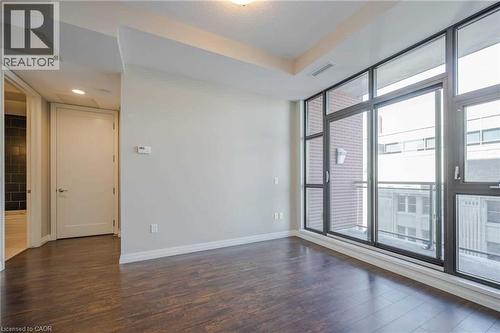 Expansive window wall with dark framing and a glass balcony railing - 112 King Street E Unit# 907, Hamilton, ON 