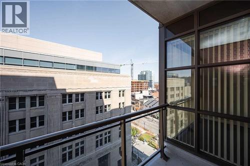 Private balcony with glass panel railing and city skyline - 112 King Street E Unit# 907, Hamilton, ON 