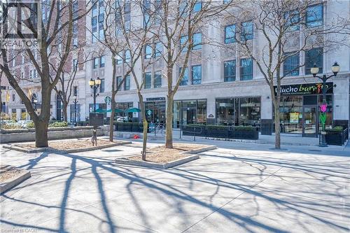 Commercial storefronts featuring large display windows and pedestrian access - 112 King Street E Unit# 907, Hamilton, ON 