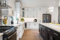 Oversized kitchen island and storage cupboards - 