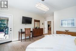 Primary bedroom with walk-out to back dec - 