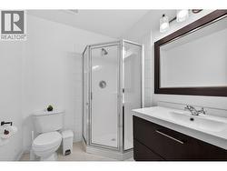 Private ensuite with a walk-in shower and clean, modern finishes - 