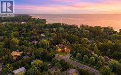 Aerial perspective showcasing a residential area with extensive mature tree coverage - 