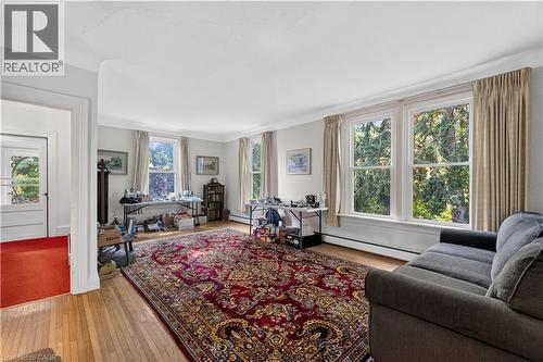 Spacious room featuring wood flooring, multiple large windows - 1629 Gregory Road, St. Catharines, ON 