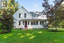 Light-colored siding exterior featuring a gable roofline and a covered porch - 1629 Gregory Road, St. Catharines, ON 