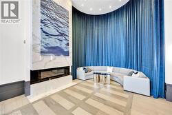 Modern accent wall featuring a linear fireplace, marble-finish surround, and an integrated art panel - 