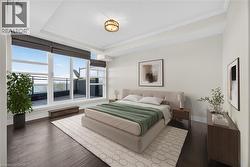 Floor-to-ceiling windows with direct outdoor access, dark wood-finish flooring, recessed lighting, and crown molding - 