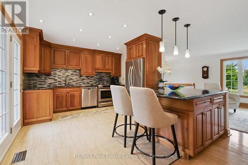 Quartz countertops and Cherry Wood Cabinets. - 9098 Sideroad 27 Road, Erin, ON - Indoor Photo Showing Dining Room