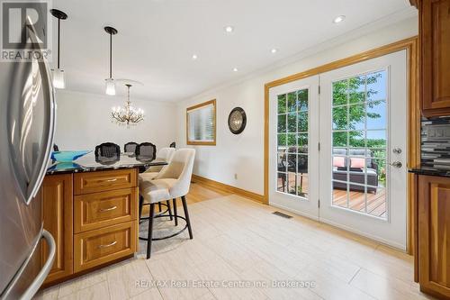 French doors to composite deck. - 9098 Sideroad 27 Road, Erin, ON - Indoor Photo Showing Kitchen