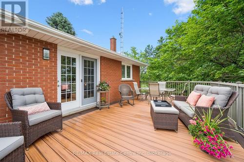 A patio with perennial gardens. - 9098 Sideroad 27 Road, Erin, ON - Outdoor With Deck Patio Veranda With Exterior