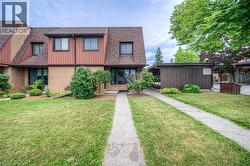 Brick and siding exterior with dark trim windows - 