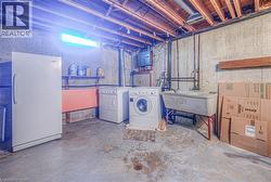 Concrete flooring with exposed ceiling joists and utility piping - 