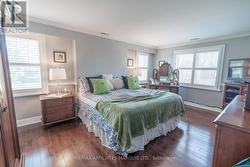Primary with 3 windows and 2 walk-in closets - 