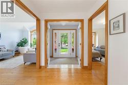 Entryway featuring wood-finish flooring and light-toned walls - 