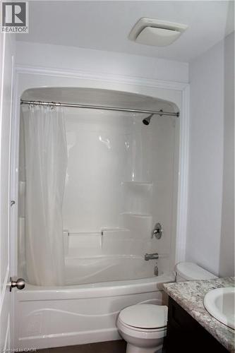 White tub and shower combination with chrome fixtures - 27 Stillwater Street, Kitchener, ON 