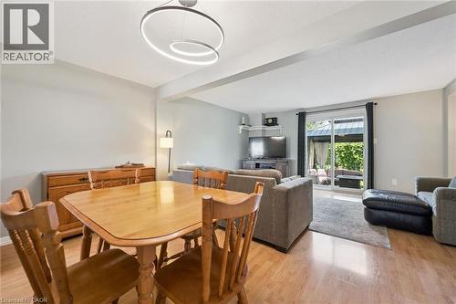 Open concept living area featuring light wood-finish flooring - 315 Mayview Crescent Unit# B, Waterloo, ON 