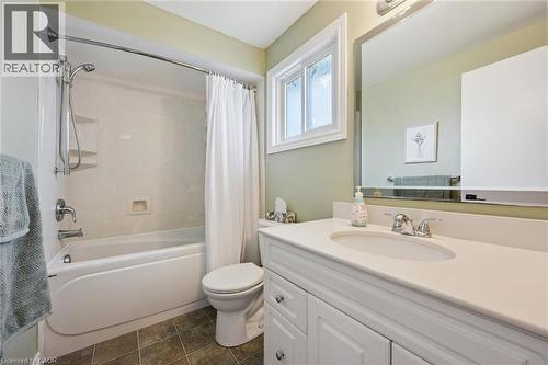 Bathroom featuring a white vanity with a light-colored countertop, an undermount sink, and chrome fixtures - 315 Mayview Crescent Unit# B, Waterloo, ON 