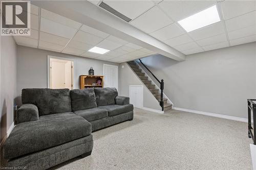 Finished lower level featuring light gray walls, carpeted flooring, and a drop ceiling with recessed lighting - 315 Mayview Crescent Unit# B, Waterloo, ON 
