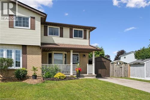 Traditional two-story residence with a covered porch, bay window, and a combination of brick and siding exterior - 315 Mayview Crescent Unit# B, Waterloo, ON 