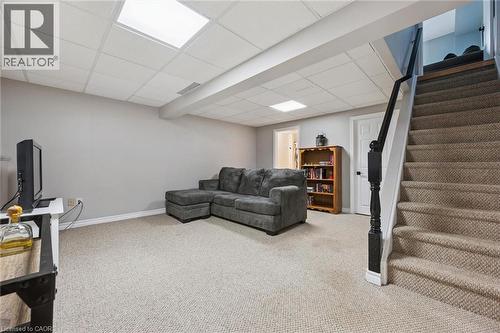 Carpeted lower level featuring drop ceiling with recessed lighting - 315 Mayview Crescent Unit# B, Waterloo, ON 