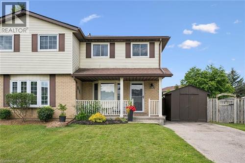 Two-story residence featuring a brick and siding exterior with brown shutters - 315 Mayview Crescent Unit# B, Waterloo, ON 