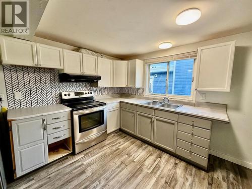 832 106 Avenue, Dawson Creek, BC - Indoor Photo Showing Kitchen With Double Sink