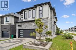 Contemporary exterior with stone and stucco finishes - 