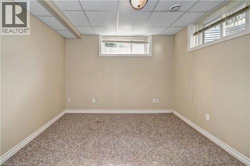 Finished room with textured carpet flooring and neutral wall paint - 760 Paris Boulevard, Waterloo, ON 