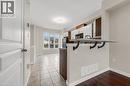 Contemporary kitchen with two-tone cabinetry and stainless steel appliances - 8 Hemlock Way Unit# 22, Grimsby, ON 