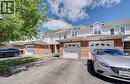 Exterior featuring brick and siding construction, dormer windows, attached garage, paved driveway, and mature tree - 139 Werstine Terrace, Cambridge, ON 