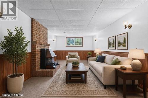Virtually Staged - Rec Room with gas fireplace - 5051 Brady Avenue, Burlington, ON 