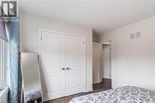 Dual white paneled doors with dark hardware - 47 Hawke Crescent, New Tecumseth, ON 