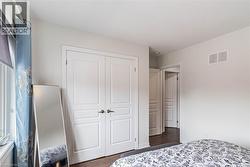 Dual white paneled doors with dark hardware - 