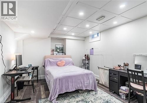 Recessed lighting illuminates this room, featuring wood-finish flooring and a dropped panel ceiling - 47 Hawke Crescent, New Tecumseth, ON 