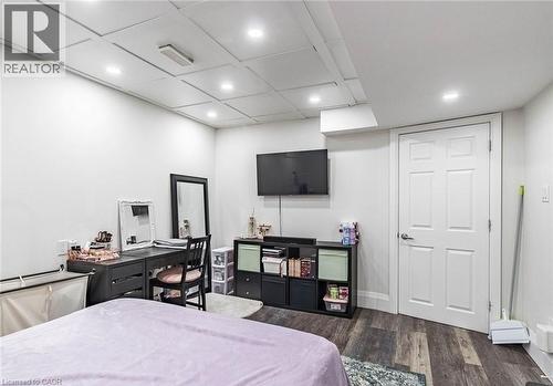 Spacious room featuring wood-finish flooring, recessed lighting, and a paneled ceiling - 47 Hawke Crescent, New Tecumseth, ON 