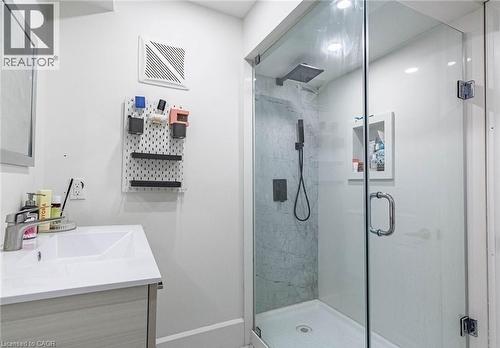 Glass-enclosed shower with a rainfall showerhead and handheld sprayer - 47 Hawke Crescent, New Tecumseth, ON 