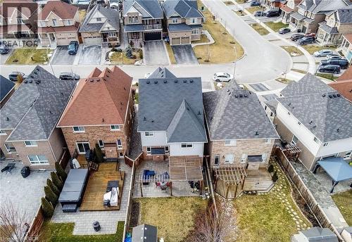 Rear exterior featuring a brick facade with a sliding glass door - 47 Hawke Crescent, New Tecumseth, ON 