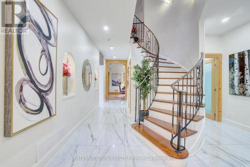 Grand two-storey foyer with porcelain flooring. - 6 Pinehurst Lane, Springwater, ON - Indoor Photo Showing Other Room