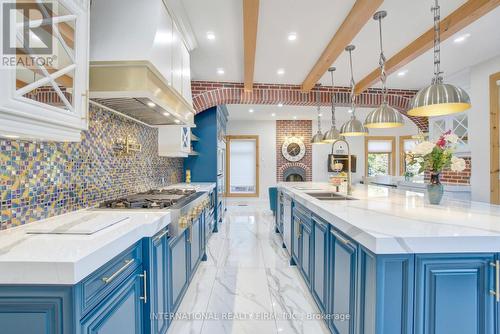 Exquisite backsplashes, lighting and brick arches. - 6 Pinehurst Lane, Springwater, ON - Indoor Photo Showing Kitchen With Double Sink With Upgraded Kitchen