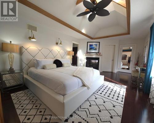 Spacious primary retreat with two walk-in closets. - 6 Pinehurst Lane, Springwater, ON - Indoor Photo Showing Bedroom