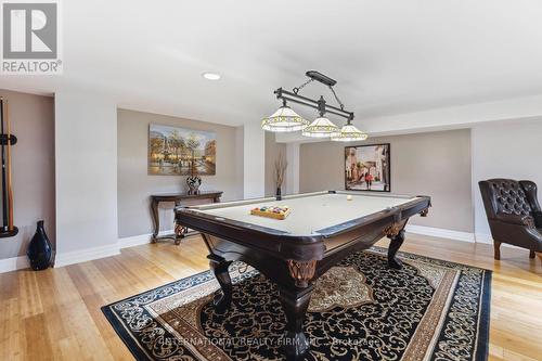 Executive billiards lounge with bamboo flooring. - 6 Pinehurst Lane, Springwater, ON - Indoor Photo Showing Other Room