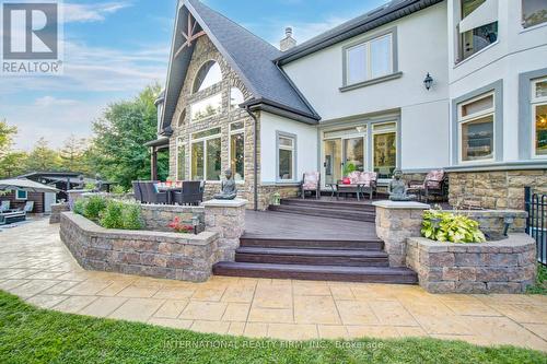 Generous outdoor deck & expansive hosting patio. - 6 Pinehurst Lane, Springwater, ON - Outdoor With Deck Patio Veranda