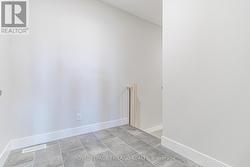 Mid-level mudroom opposite garage entry - 