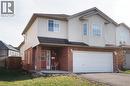 Two-story residence featuring light-colored siding and brick detailing - 17 Hawkswood Drive, Kitchener, ON 