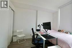 White walls and wood-finish flooring provide a neutral aesthetic - 