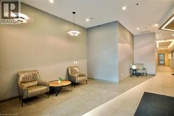 Contemporary lobby featuring textured wall coverings and recessed lighting - 