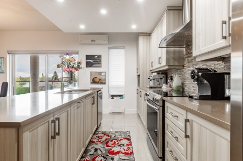 Kitchen - 304-7755 Boul. St-Martin O., Laval (Sainte-Dorothée), QC - Indoor Photo Showing Kitchen With Upgraded Kitchen