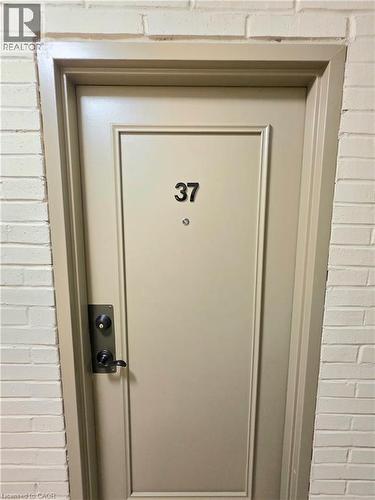 Panel-style door with dark hardware - 2373 E King Street E Unit# 37, Hamilton, ON 