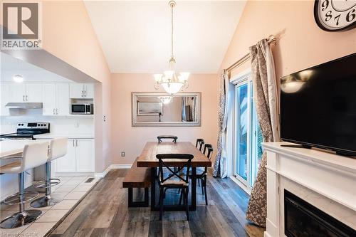 Dining area featuring vaulted ceilings and wood-finish flooring - 171 Mcnichol Drive, Cambridge, ON 